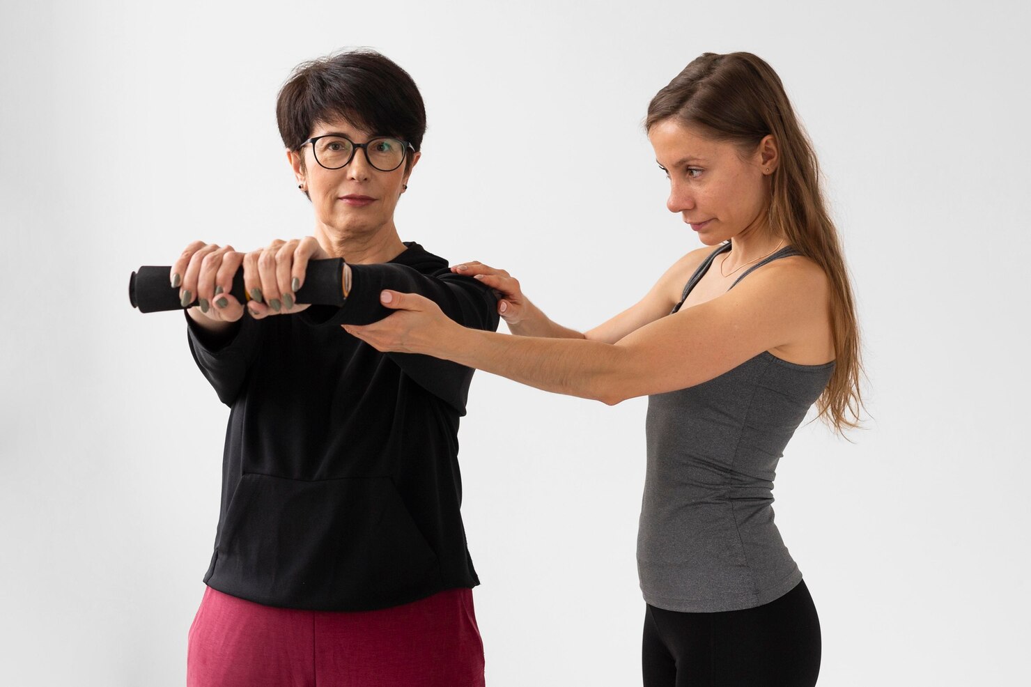woman helping friend train